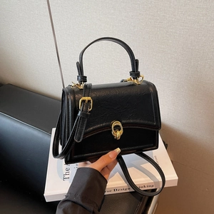 Retro black leather crossbody handbag with gold twist lock and adjustable strap