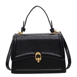 Vintage black leather crossbody bag with gold interlocking hardware and top handle