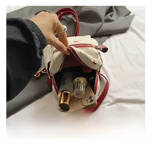 Detail view of the mini backpack interior capacity with phone and cosmetics