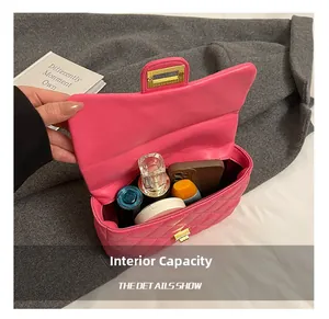 Detailed interior storage view of magenta quilted crossbody bag with daily essentials