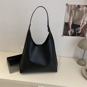 Minimalist black PU leather tote bag with long strap for commuting and daily fashion