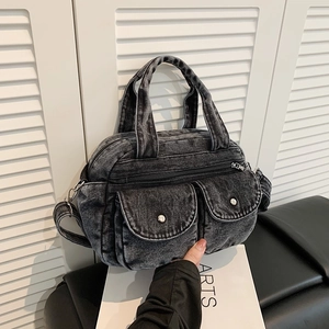 Retro washed denim crossbody bag with dual front pockets and adjustable shoulder strap