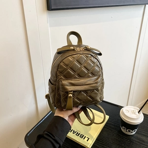 Olive green quilted mini backpack with gold zippers and diamond stitch pattern