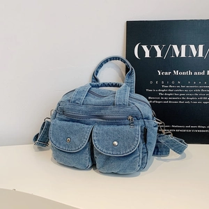 Vintage denim patchwork crossbody bag with silver buckle pockets and top handle