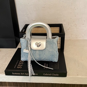 Quilted blue denim mini handbag with silver heart lock and metallic handle