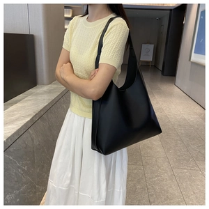 Chic black matte hobo shoulder bag styled with an elegant casual outfit for workwear