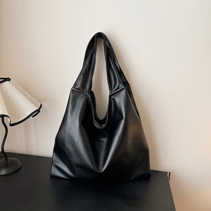 Minimalist black PU leather tote bag with a soft Hobo structure and spacious interior