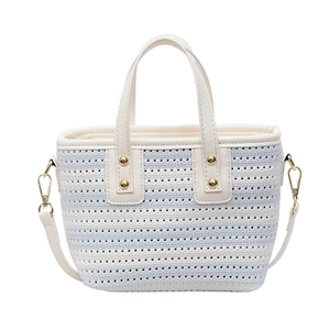 Chic blue and white striped woven bucket bag with leather handles and gold rivet accents