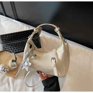 Cream white glossy patent leather hobo bag with star charms and silver hardware accents