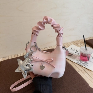 Borsa a mano rosa a quadretti con fiocco e ciondolo a stella in stile Y2K
