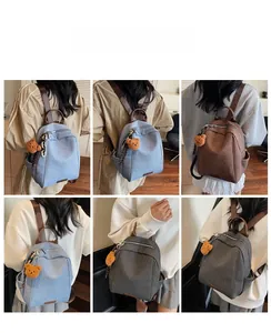 Various lifestyle views of denim backpack in light blue, brown and charcoal with bear charm