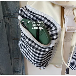 Close-up of the functional zippered side pocket showing ample storage for a smartphone
