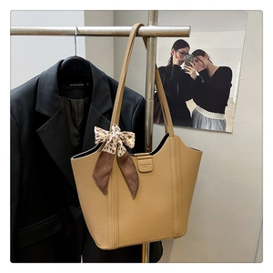 Brown litchi grain leather tote bag featuring a decorative leopard print silk scarf