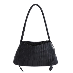 Minimalist black hand-woven leather tote bag with drawstring and top handles