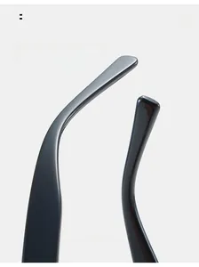 Detail of curved black sunglass arms showing ergonomic arc for comfortable ear fit