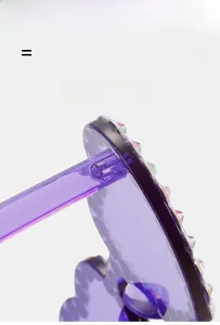 Detail of purple transparent heart sunglasses showing elastic frame and rhinestone accents