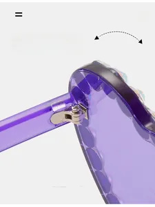 Detail of durable metal hinge on purple heart sunglasses with colorful rhinestones