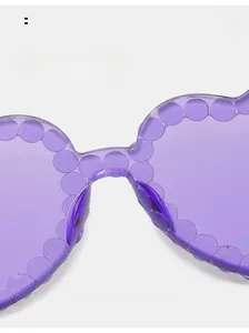 Macro shot of comfortable nose pads on purple transparent heart sunglasses