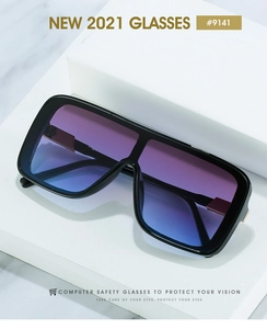 Detail of black oversized square sunglasses with gold metal hinges and gradient blue lenses