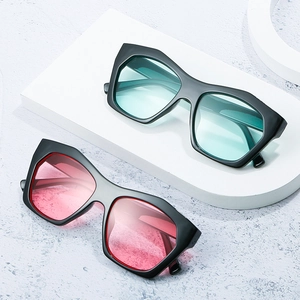 Retro geometric square sunglasses with black frames and light blue or pink tinted lenses