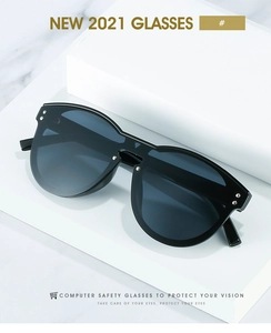 Detail of black oversized computer glasses with silver studs on white geometric stand