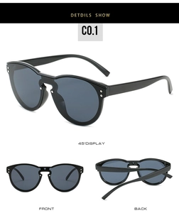Black oversized frame sunglasses featuring silver rivet accents and dark grey lenses