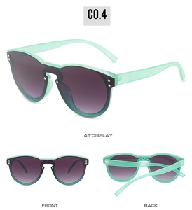 Detail view of mint green oversized shield sunglasses with purple gradient lenses and rivets