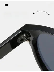 Detail view of durable metal hinge on black oversized sunglasses with sturdy construction