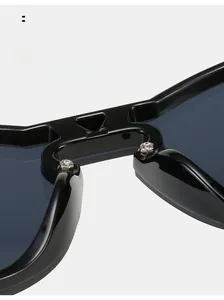 Detailed macro view of comfortable integrated nose pads on black oversized sunglasses