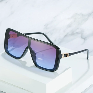 Oversized square one-piece sunglasses with gradient lenses and gold metal accents