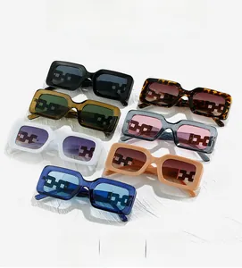 Detailed flat lay of rectangular sunglasses with thick frames and hollow chain temples