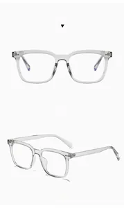 Detail view of transparent gray TR90 square glasses frame with reinforced metal hinges