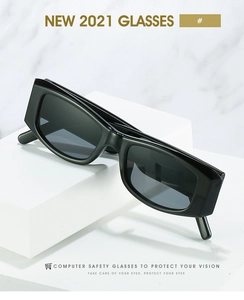 Detail of retro thick-frame sunglasses on geometric white marble blocks for product display