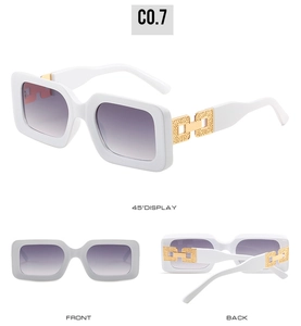 Detail view of white square sunglasses with purple gradient lenses and gold chain temples