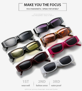Collection of colorful rectangle sunglasses stacked to show glossy frames and diverse lenses