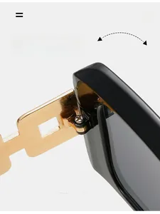 Close-up of durable golden geometric hollow hinge on black square sunglasses