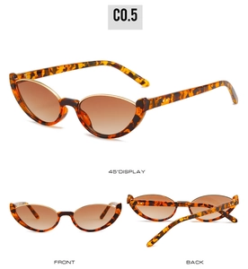 Vue détaillée de lunettes œil de chat léopard avec accents métalliques et verres marrons