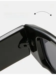 Macro view of durable metal hinge on retro sunglasses with glossy black finish