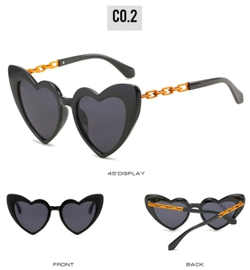 Detailed views of heart-shaped sunglasses with black frames and orange chain temples
