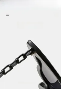 Detail of black heart sunglasses with fashion chain temple and flexible hinge construction