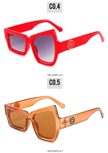 45-degree angle of irregular geometric sunglasses in glossy red and transparent brown