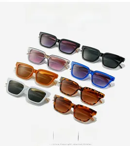 Macro shot of stylish square sunglasses with gold metal accents on multicolor frames