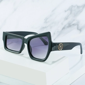 Modern oversized sunglasses with thick black frames and purple gradient lenses
