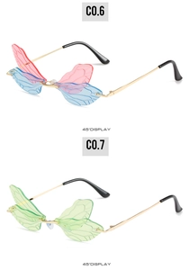 Detail view of dragonfly wing sunglasses in pink and green with gold metal temples
