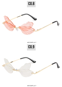 Detailed 45-degree view of novelty dragonfly wing rimless sunglasses in orange and clear