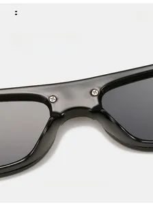 Detail of square sunglasses showing high-quality nose pads and metallic screw reinforcement