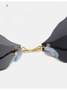 Detail of comfortable silicone nose pads and golden metal bridge on dragonfly sunglasses