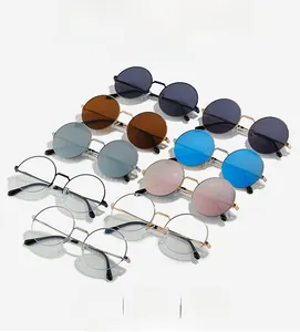 Flat lay of vintage round metal sunglasses in various lens colors with fine frames