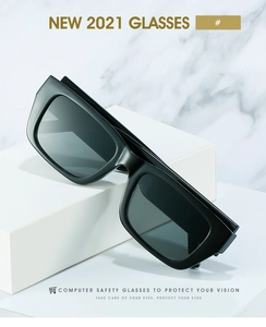 Detail of square black glasses frame with anti-blue light lenses on marble background