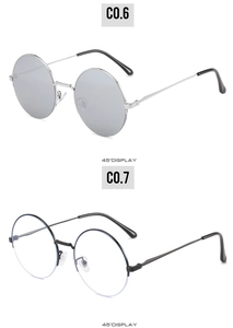 Detail display of retro round metal sunglasses with reflective and clear lenses